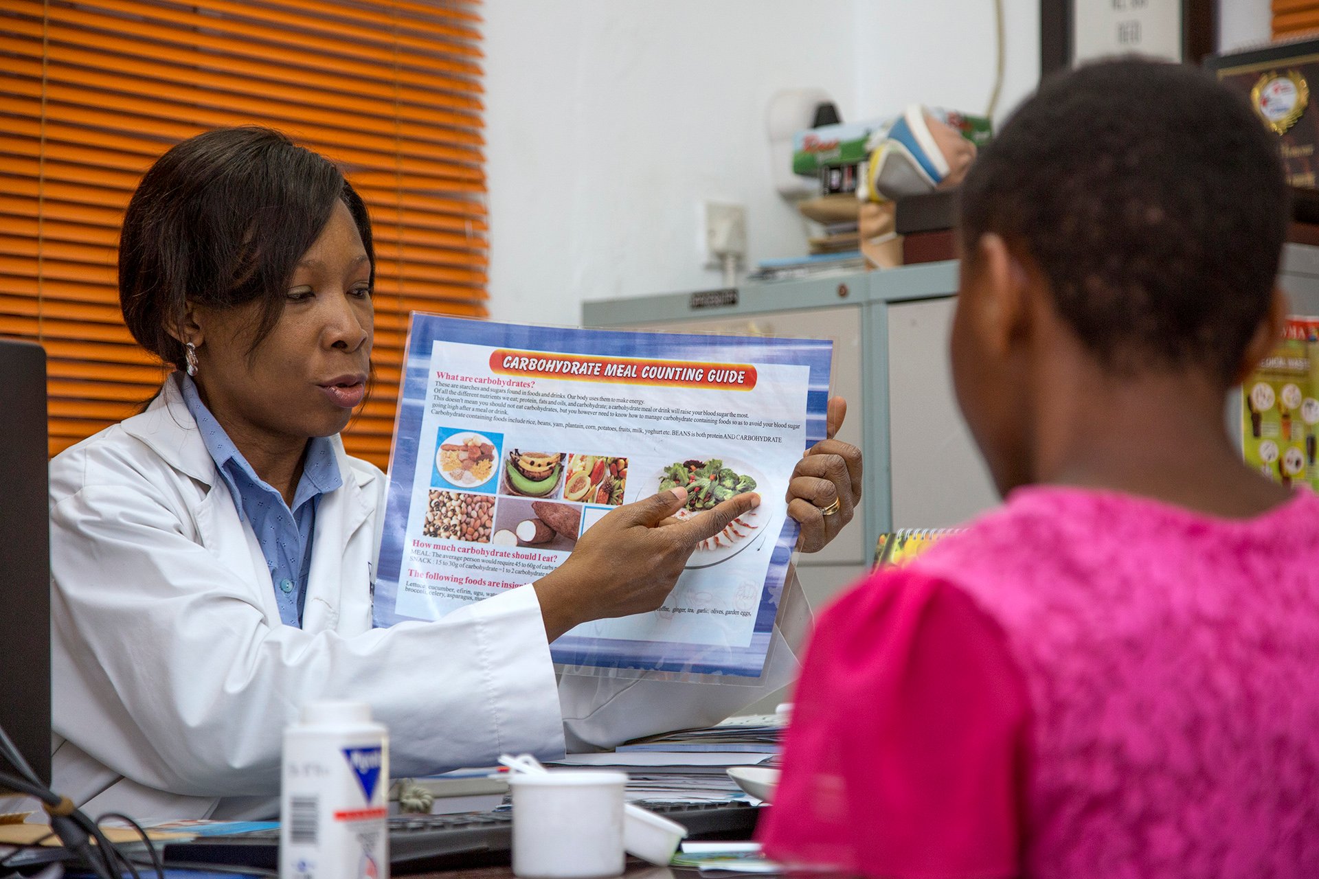 A doctor showing a patient an image